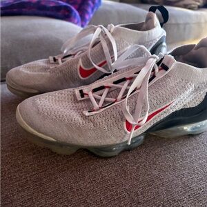 Nike Flyknit Sneakers with Red Swoosh